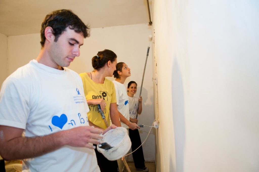 BGU students help paint and repair the apartments of the needy and elderly as a pre-Passover initiative.