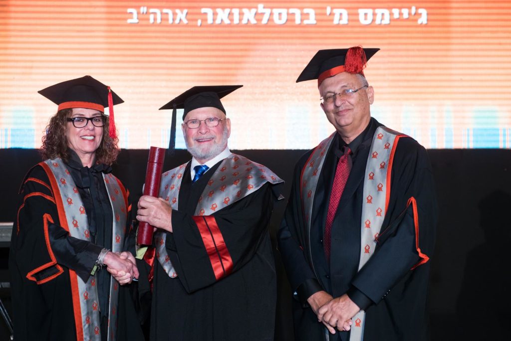 Jim Breslauer (center) receives honorary doctorate from from BGU President Prof. Rivka Carmi and Rector Zvi HaCohen at BGU’s 44th Board of Governors Meeting.