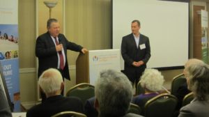 Alon Ben-Gurion, David Ben-Gurion grandson who lives in Westchester, speaks at an Americans for Ben-Gurion University event in Manhattan with Peter Kashin, event host and regional board member, onlooking.