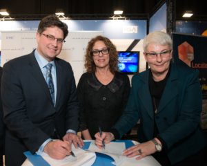 Lockheed Martin and EMC executives sign agreement to fund collaborative research at CyberSpark as BGU President Prof. Rivka Carmi looks on.