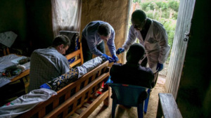 Dr. Lobel visiting an Ebola survivor in his home.