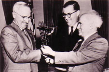 President Harry S. Truman accepts a menorah in 1951 from Abba Eban, Israel’s ambassador to the U.S. and U.N., and Prime Minister David Ben-Gurion. 