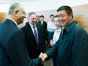 BGU's Rector Prof. Zvi HaCohen greets Wang Wenbiao, chairman and president of the Elion Resources Group, with Prof. Amos Drory, BGU's vice president for external affairs.