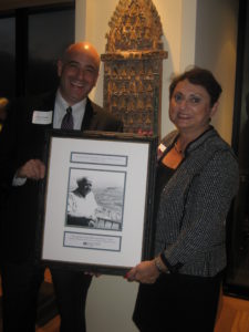 Americans for Ben-Gurion University Executive Vice President Doron Krakow presents Sonny Hurst with a framed photograph of David Ben-Gurion in appreciation of her leadership.