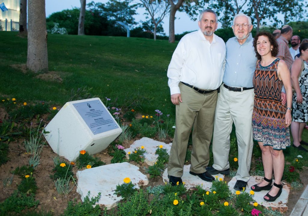 Gary Sutnick, Dr. Alton Sutnick and Amy Sutnick-Plotch in Mona's Garden at the dedication.