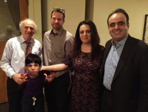 Nine-year-old Michael Boussina with his grandfather, Baryohay Davidoff (left), his parents Eileen and Nersi Boussina (right) and BGU neuroscientist Dr. Ilan Dinstein (center)