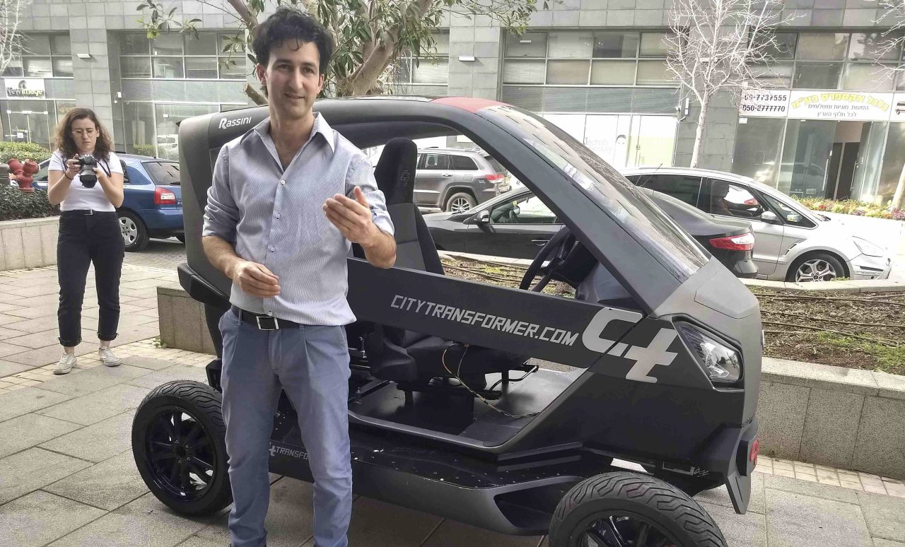 City Transformer CEO Asaf Formoza with a prototype of his folding car in Israel (Photo: Maya Mirsky)